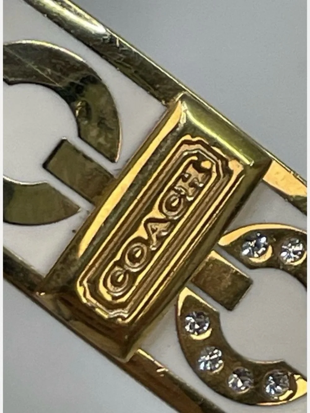 Coach Signature Enamel and Crystal Bangle Bracelet.